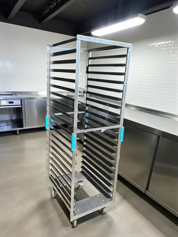 Commercial grade full-height mobile pan rack in great condition, rolls smoothly. Features multiple shelves and sturdy casters.