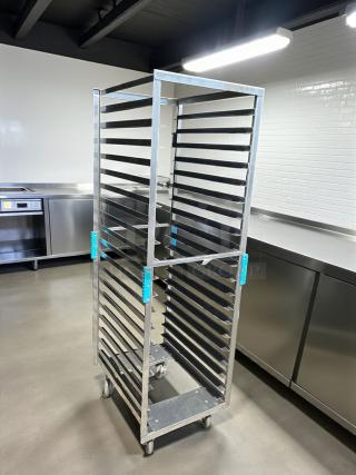 Commercial grade full-height mobile pan rack in great condition, rolls smoothly. Features multiple shelves and sturdy casters.