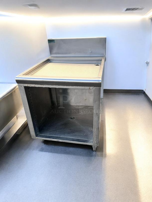 Supreme Metal stainless steel underbar drainboard, 22" x 30" x 36", in great condition. Features top drainage and open underbar.