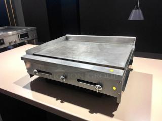 36" commercial flat top griddle in outstanding working condition, tested and functional, with metal knobs and smooth cooking surface.