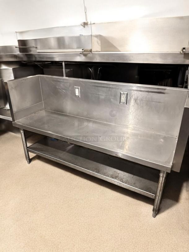 Stainless steel commercial work table, 65"x24"x40", with two outlets and undershelf, great condition, tested and working.
