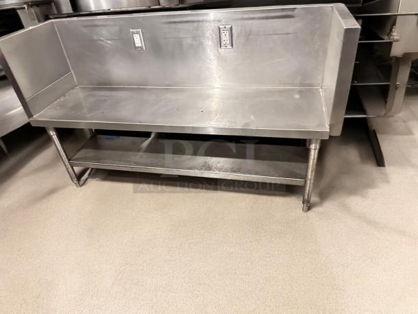 Stainless steel commercial work table with undershelf, two electrical outlets, 65"x24"x40", great condition, tested.