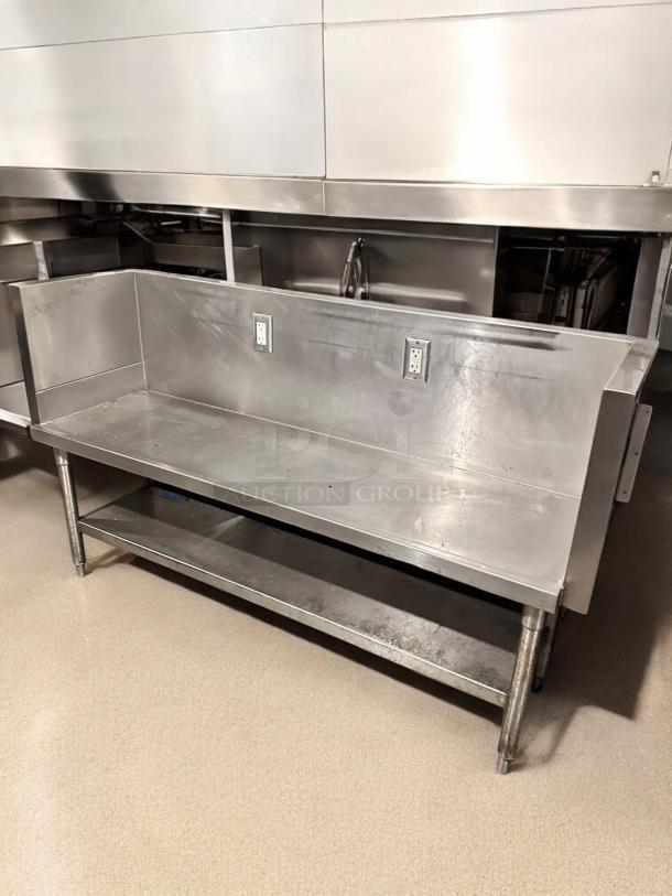 Stainless steel commercial work table, 65"x24"x40", with two electrical outlets and undershelf. Great condition, tested working.