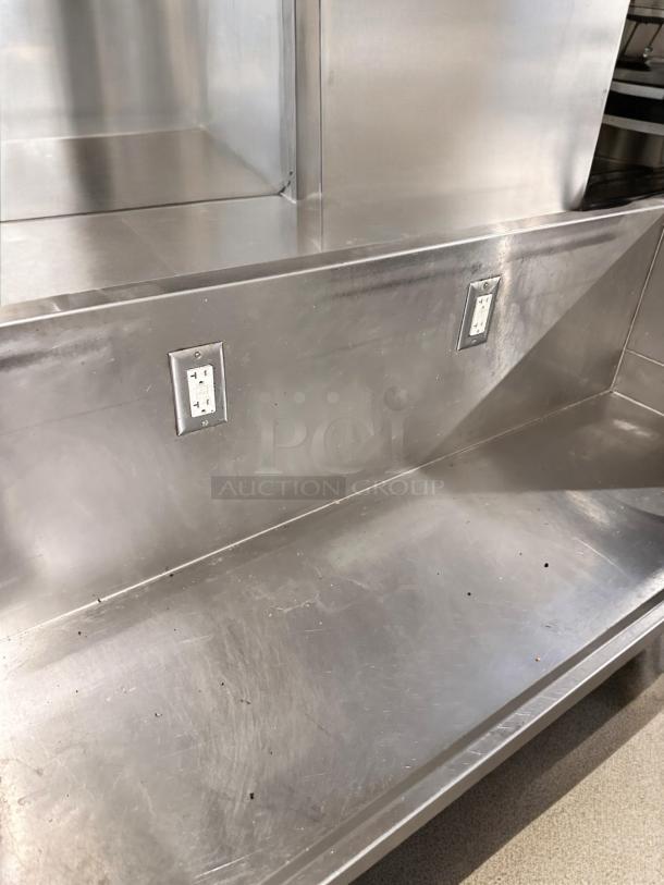 Stainless steel commercial work table with two outlets, undershelf, 65"x24"x40", great condition, tested and working.