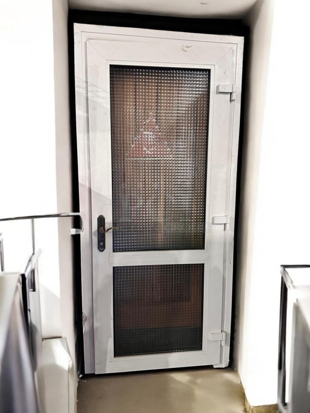 White metal frame door with dual textured glass panels, 36"x83". Great condition, tested and working, elegant modern design.