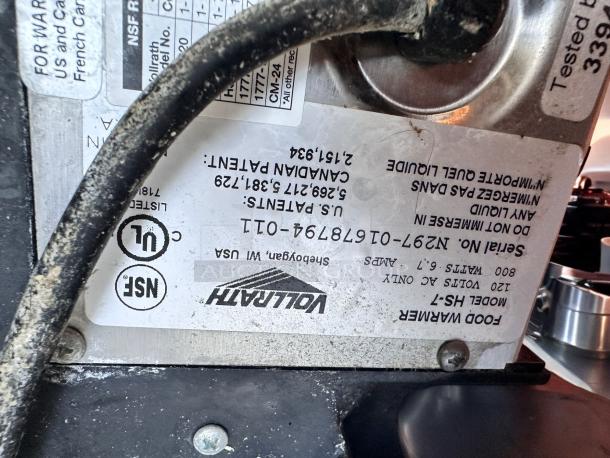 Vollrath Cayenne HS-7 food warmer label, showing model, serial number, and specifications. Round, 7 qt capacity, 120V.