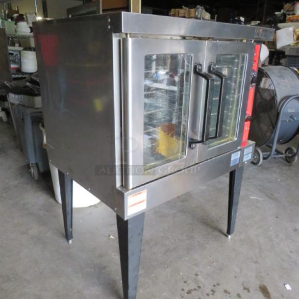 Vulcan full-size electric convection oven, Model VC4ED-11D1. Contains 5 racks. 208 Volt, 3 Phase. Dimensions: 41x31x55 inches.