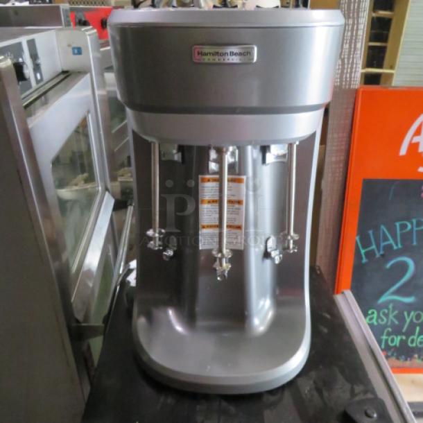 Hamilton Beach Triple Spindle Drink Mixer, Model HMD400, 120V, silver finish, excellent condition, valued at $1039.00.