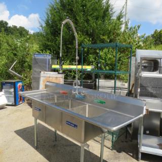 Steelton 3-compartment sink with R/L drain boards and faucet with hose sprayer, Model# 522CB316201B, in used condition.