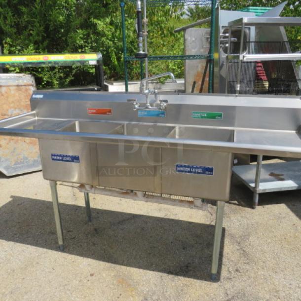 Steelton 3-compartment stainless steel sink with R/L drain boards, model 522CB316201B, includes faucet and hose sprayer.