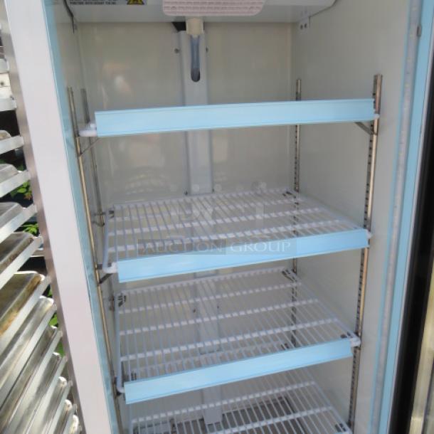 Avantco 1 Door Glass Display Cooler, Model 178GDC10HCW, with four racks, 115V, in working condition, 21x24x62.5 inches.