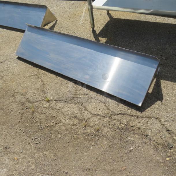 Stainless steel wall mount shelf, 48x12x11 inches, with brackets. Reflective finish, suitable for kitchen or storage use.