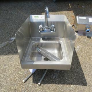 Regency stainless steel handsink with backsplash, model #600HS12P. Includes faucet. Dimensions: 12"x15"x10".