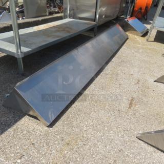 Stainless steel wall mount shelf with brackets, 96x12x12 inches. Appears new with polished finish and no visible damage.