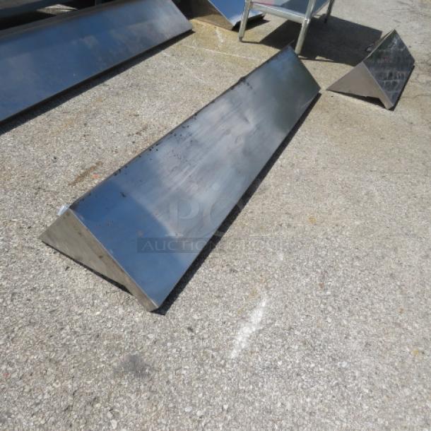 Stainless steel wall mount shelf with brackets, 72x12x12, new condition, reflective surface, durable construction.