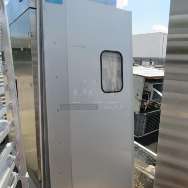 One kitchen traffic door with hardware, dimensions 34.5x78.5 inches, silver finish, features a rectangular window.
