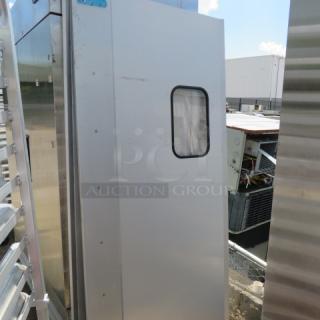 One kitchen traffic door with hardware, dimensions 34.5x78.5 inches, silver finish, features a rectangular window.