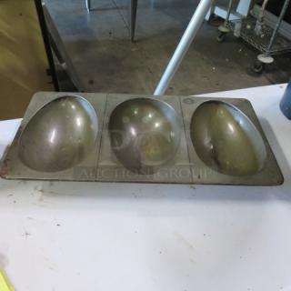One Chicago Ecko commercial baking pan with three dome-shaped molds, metal construction, slightly worn condition.