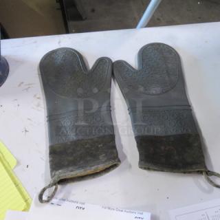 Silicone insulated oven gloves, 2XBID brand, gray with black textured grip, well-worn condition, with hanging loops.