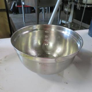 4 quart stainless steel mixing bowl, used condition, visible measurement markings inside, smooth finish.