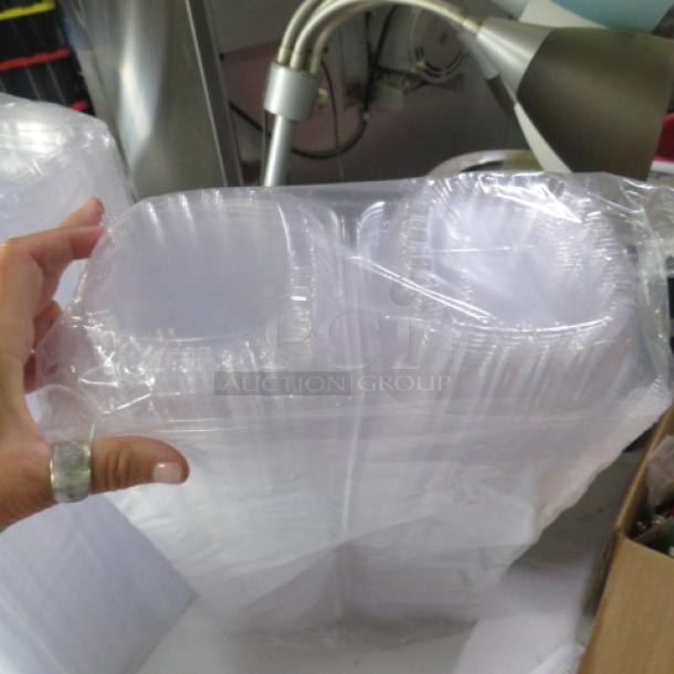 Clear plastic hinged lid sandwich to-go boxes in a sealed pack, new condition.