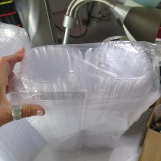 Clear plastic hinged lid sandwich to-go boxes in a sealed pack, new condition.