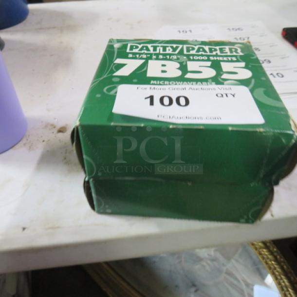 Box of 5.5x5.5 sandwich papers, 1,000 sheets, label shows "7B55" and "Patty Paper," green packaging, slight wear.
