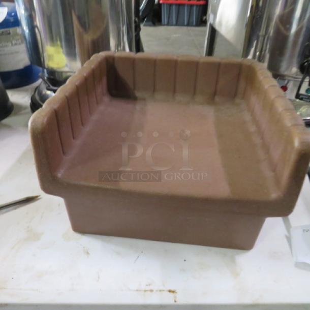 Vollrath booster seat, brown, sturdy plastic, ribbed interior, lightly used condition, ideal for restaurant or child seating needs.