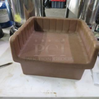 Vollrath booster seat, brown, sturdy plastic, ribbed interior, lightly used condition, ideal for restaurant or child seating needs.