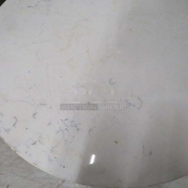 Round marble top in white with subtle gray veining, measuring 20x26 inches. Polished surface, in good condition.