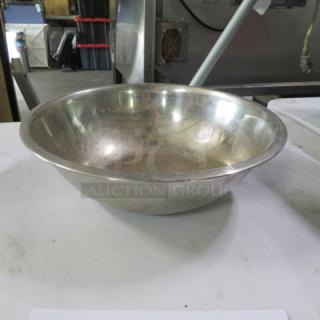 13-inch stainless steel mixing bowl, gently used, reflecting light. No visible markings or labels, sturdy design.