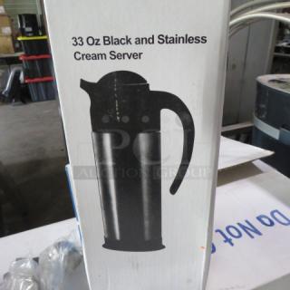 33oz black and stainless cream server, new in box, model #CRSV-33. Box shows image and label indicating cream server use.