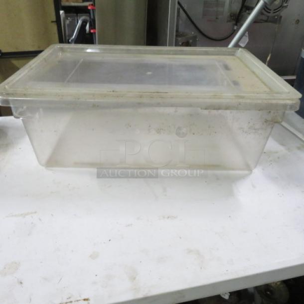 Cambro 13-gallon clear food storage container with lid; used condition with visible wear; ideal for bulk storage.