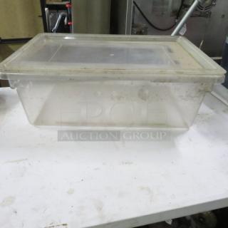 Cambro 13-gallon clear food storage container with lid; used condition with visible wear; ideal for bulk storage.