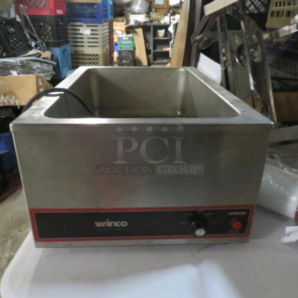 Winco FW-S500 food warmer, 120 Volt, stainless steel, used condition with visible controls and branding on front.