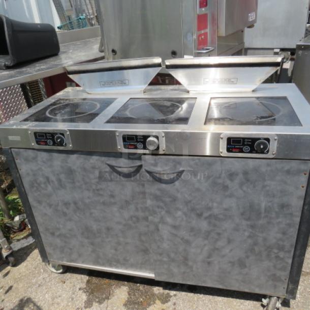 Spring USA Triple Range Induction Cooking Station, Model ICS348-26, with 2 downdraft air filters, on casters. 2600W, 208-240V.