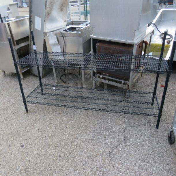 Black Metro shelf, two-tier, 60x18x35 inches, metal wire construction, good condition, ideal for storage.