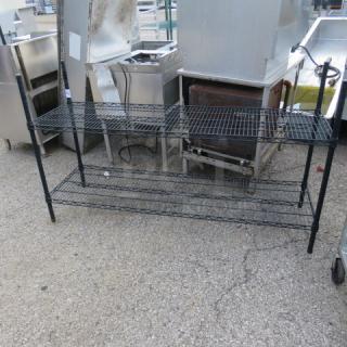 Black Metro shelf, two-tier, 60x18x35 inches, metal wire construction, good condition, ideal for storage.