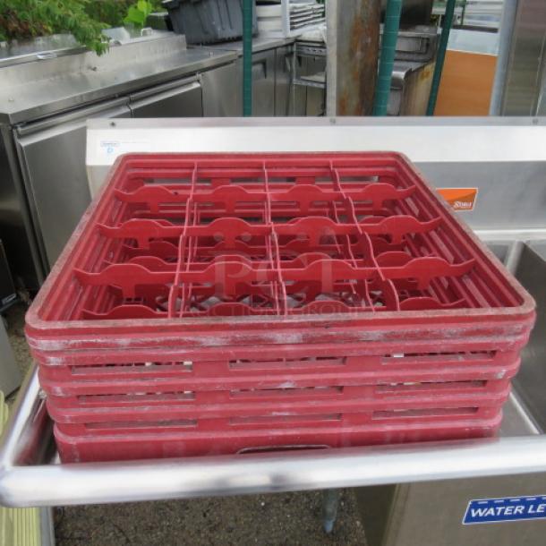 Red 16 hole dishwasher rack, model 2XBID. Sturdy plastic, used condition. Ideal for organizing kitchenware.
