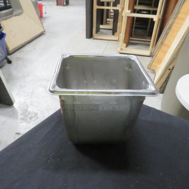 1/6 size 6-inch deep hotel pan in metal, good condition, ideal for catering use; no visible markings or labels.