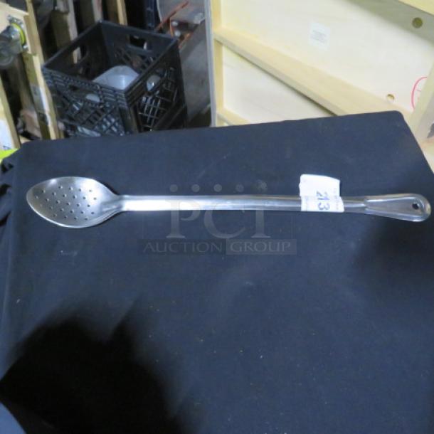 Long handle perforated stainless steel spoon, excellent condition, item no. 2XBID visible on handle tag.