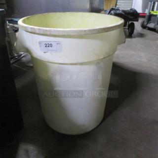 Large white garbage can, cylindrical shape, minor wear. Number "220" label attached. Suitable for industrial use.