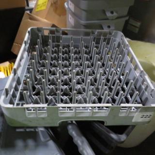 Gray dishwasher rack with vertical prongs, in used condition. Number "222" on the side. Sturdy and functional design.