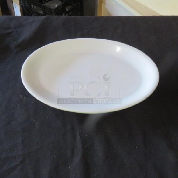 White 11.5x8-inch oval platter, smooth finish, excellent condition.