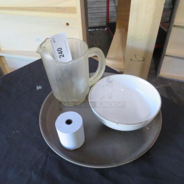 Lot of misc. items: frosted glass pitcher, white ceramic bowl, brown serving platter, and paper roll. Used condition.