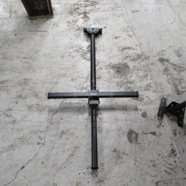 Metal TV mount with adjustable arms, in good condition, suitable for flat screens. Black finish, sturdy frame.