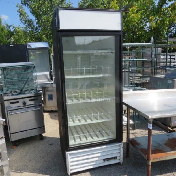 True Model GDM-26 one-door glass display cooler, 5 racks, dimensions 30x30x79 inches, 115 volt, excellent condition.