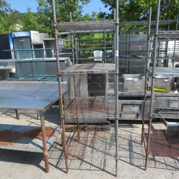 Eagle Metro metal shelf unit with 4 adjustable wire shelves, 24x30x75 inches. Rust and wear visible. Suitable for heavy-duty storage.