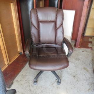 One Brown Leather Executive Office Chair On Casters. - Item #1203525