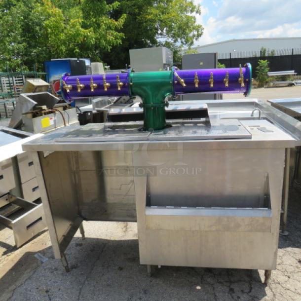 Stainless steel beverage center with 10 tap beer tower, 30-inch bottle rail, 68x34x62 inches, excellent condition.